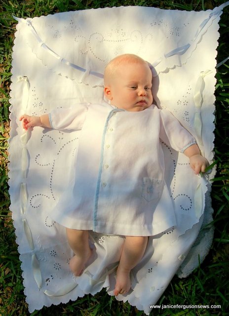 Alastair, 2 1/2 months, on antique carriage cover.  He had nearly outgrown this daygown, but this was the first time that the harried new parents got around to taking a picture for me.  It DID fit when he came home, but at 9 lb.s 6 oz. it didn't fit very long!