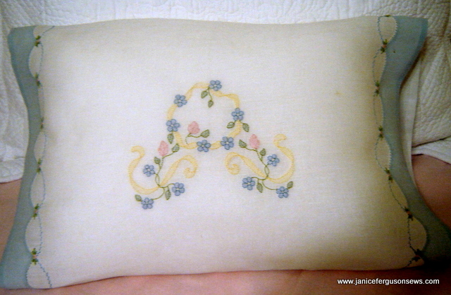 #3 Shadow Embroidered Pillowcase, $22 + shipping. Linen open ended pillowcase with shadow embroidery, Madeira applique'd hems with feather stitching and pinwheel roses all done by machine. Measures 12-1/2 x 18-1/2". Center wreath is a perfect setting for a monogram. This class sample was never used. Read details at blog post Linen Machine Shadow Embroidered Pillow.