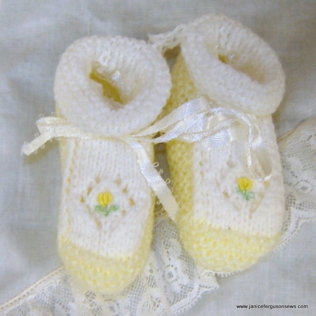 #5 Yellow Knit Booties $10 + shipping. Embellished with a yellow bullion rose on the toe of each bootie, this pair was hand knitted in Old San Juan. It has never been worn. The open work diamond surrounding the rose is such a pretty touch. Goes nicely with diaper shirt above. See more booties in blog post Beautiful Booties.
