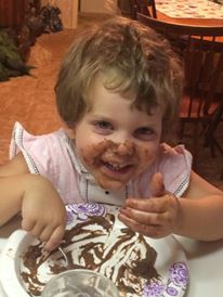 Viv "eating"Aunt Peggy's chocolate pudding. Surely a some got in her mouth. 