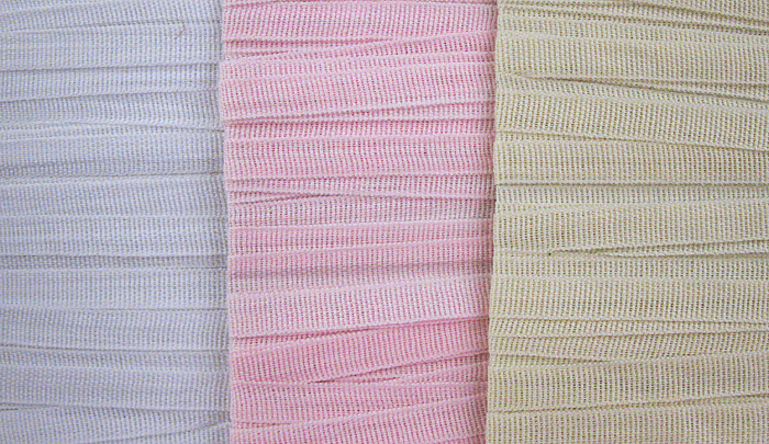 3/8" cotton lace tape, made in Switzerland. Pink, white or champagne.