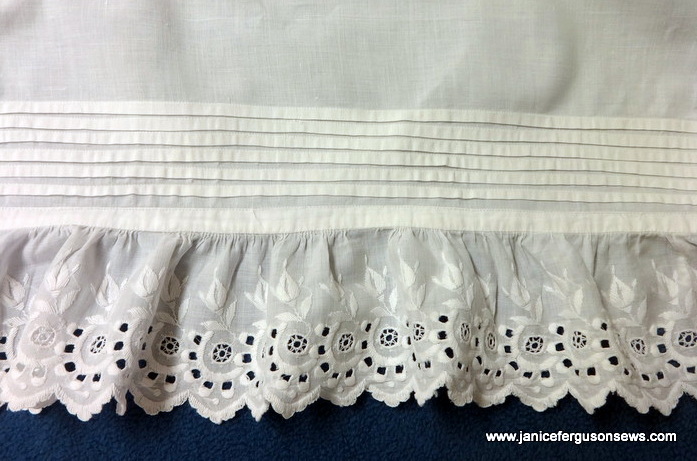 6 tucks and beautiful Swiss embroidered edging on 35" slip